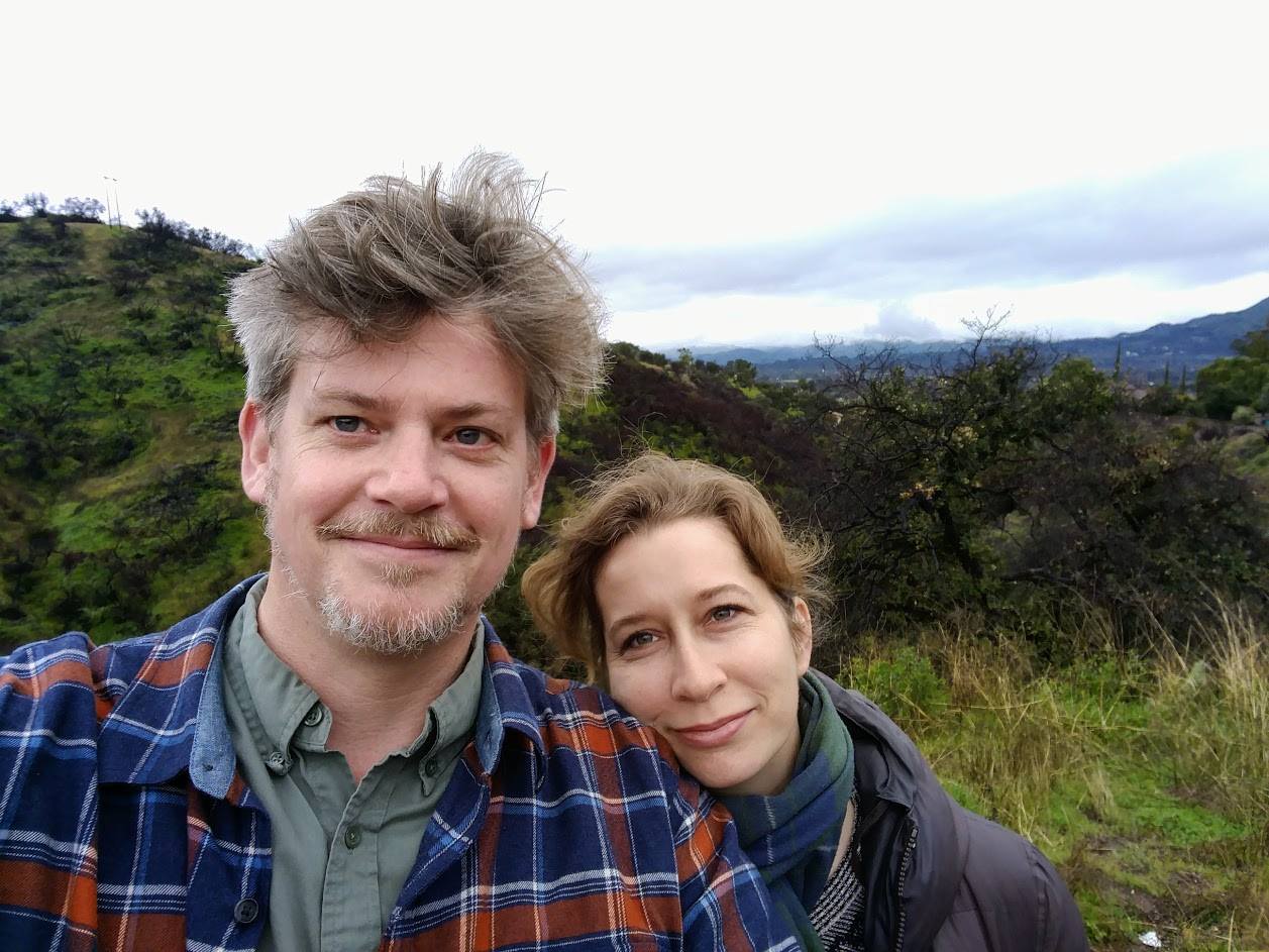 Photo of married man and woman in front of a view of trees and mountain, the providers of Sierra Madre home care.